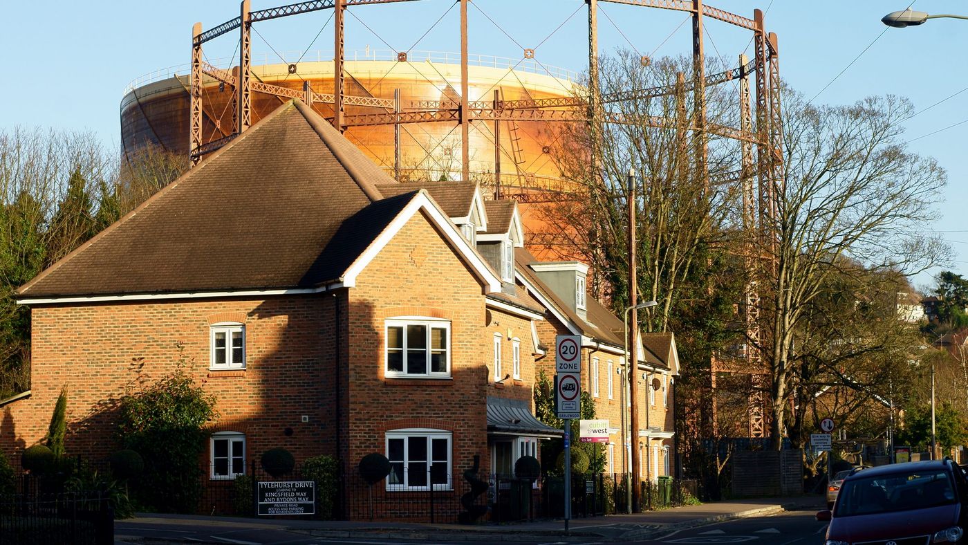 A residential street in Redhill, Surrey, with the gasholders behind