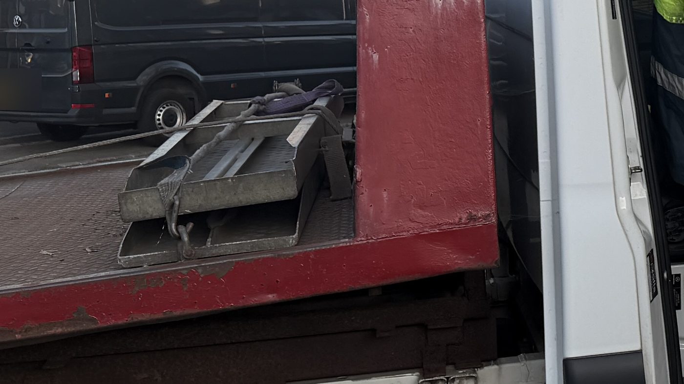 Skates and ratchet straps stowed on the bed of the truck